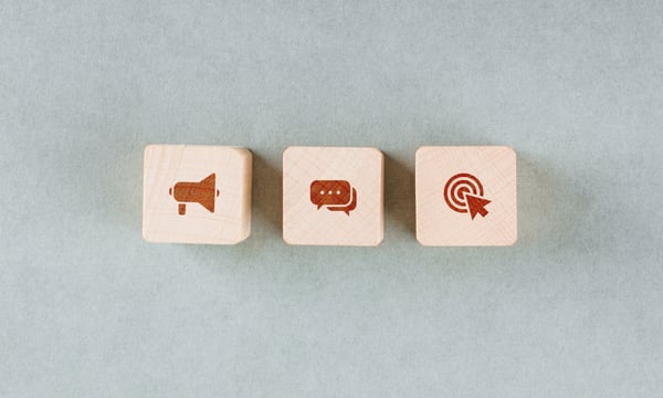 conceptual-target-with-wooden-blocks-with-red-icons